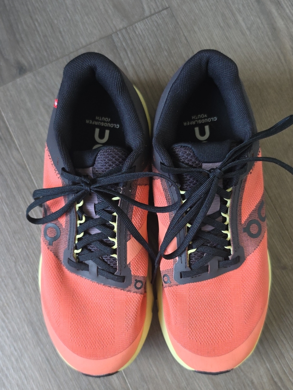 On Running Women’s Coral and Black Cloudsurfer Sneakers
